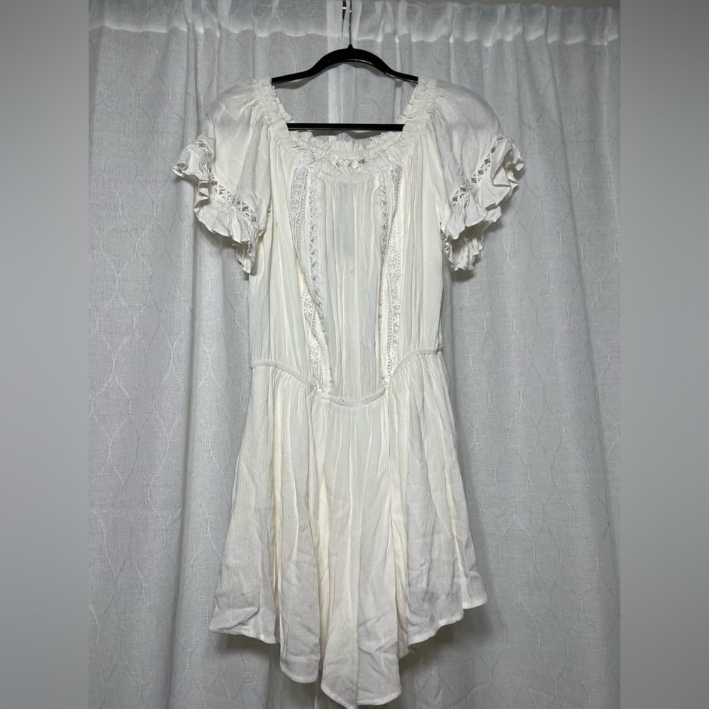 White romper. Pockets